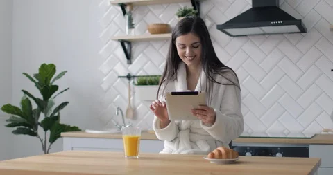 Happy Girl using Tablet in Kitchen 動画素材 103834289