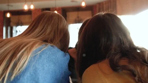 Happy girlfriends make high five sitting in cafe Stock Footage 73166200