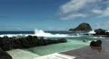 Happy girls waiting for the wave in natural ocean bath HD Footage