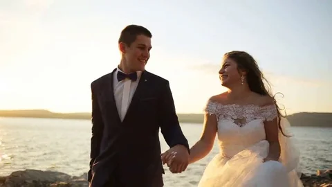 Happy gorgeous smiling bride running and having fun with elegant groomat Stock Footage 69151028