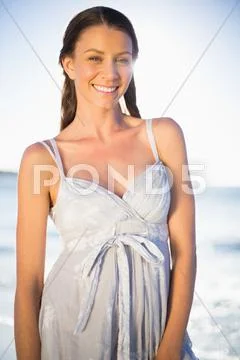 Happy gorgeous woman in summer dress posing Stock Photos