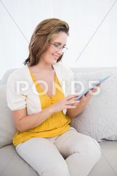 Happy gorgeous woman using tablet Stock Photos