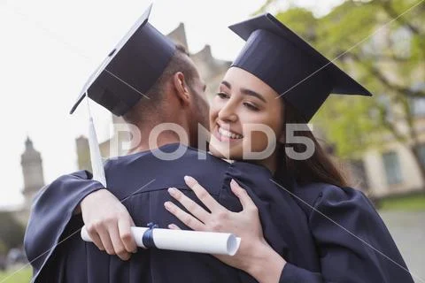 Happy graduate enjoying precious moments Stock Photos