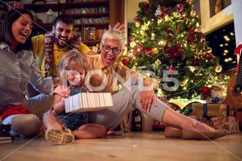 Happy grandmather and her family together for Christmas. Stock Photos