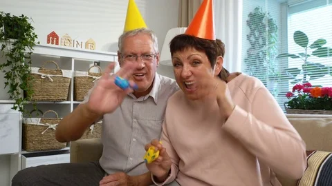 Happy Grandpa and Grandma Congratulate their Children Happy Birthday Using Stock Footage