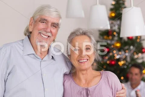 Happy grandparents at christmas Stock Photos
