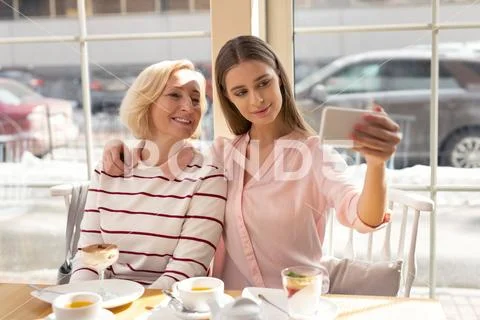 Happy granny and girl taking selfies Stock Photos