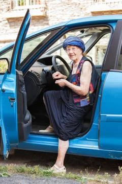 Happy granny at car Stock Photos