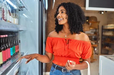 Happy, grocery shopping and woman in a supermarket with drinks at a retail store Stock Photos