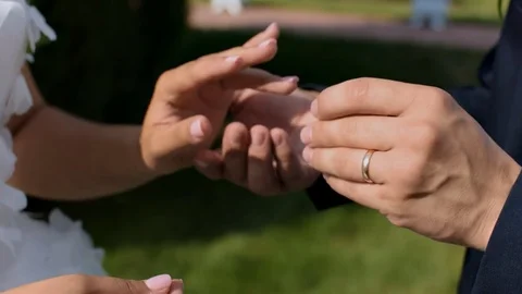 Happy the groom puts ring the beautiful bride. 動画素材 70059014