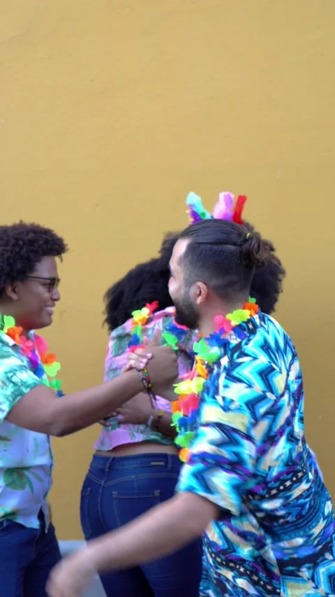 Happy group of friends having fun at a carnival street party. Stock Footage 229700873
