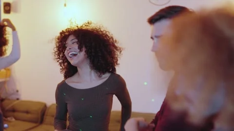 Happy group of multiethnic friends dancing at home Stock Footage 274430456