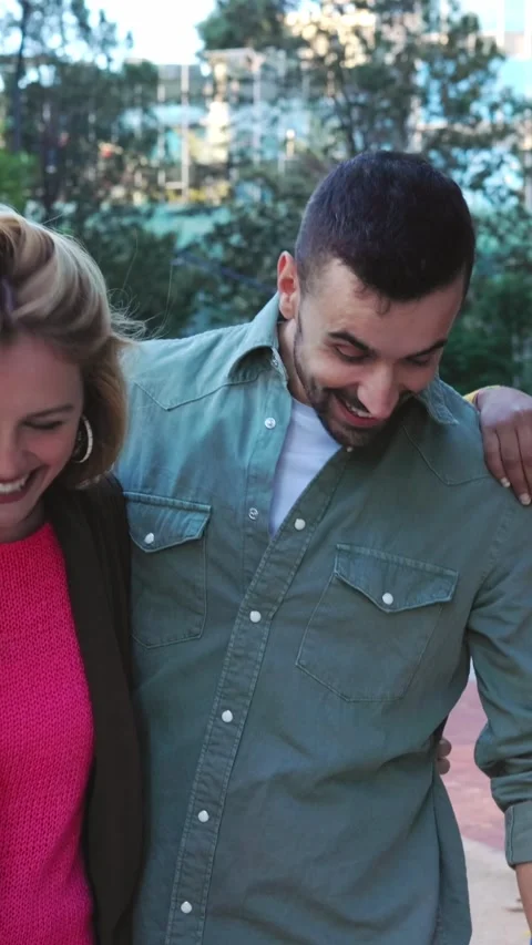 Happy group of multiracial friend hanging out while walking together at city Stock Footage 312262053