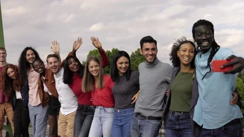 Happy group of young people using mobile phone having fun outdoor Stock Footage 231805694