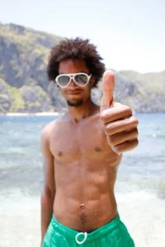 Happy guy on the beach Stock Photos