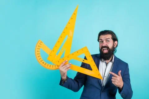 Happy guy ready to study mathematics with triangle and protractor, stem 写真素材