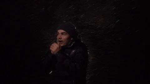 Happy guy smiling young man. Heavy snow. Man looking in different directions Stock Footage 122295944