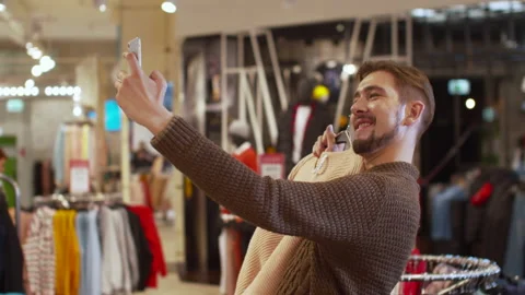 Happy guy takes a selfie with a jacket Stock Footage 119422442