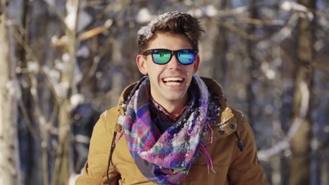 Happy guy throwing snow up in front of camera. Winter mood. Winter, sport Stock Footage 143617856