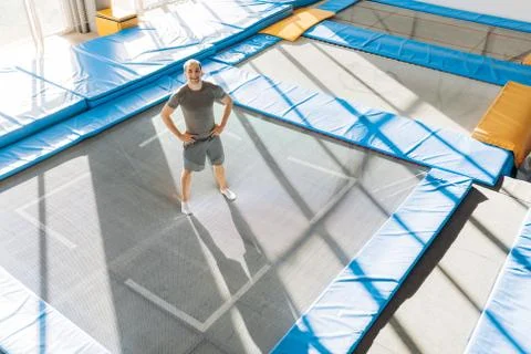 Happy guy on the trampoline Stock Photos
