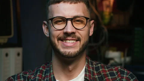 Happy hacker portrait. Smiling programmer looking in camera close-up. Young man Vídeos de archivo 193807298