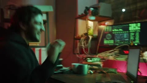Happy hacker typing on keyboard at night, breaking password, using laptop and Stock Footage 158620737