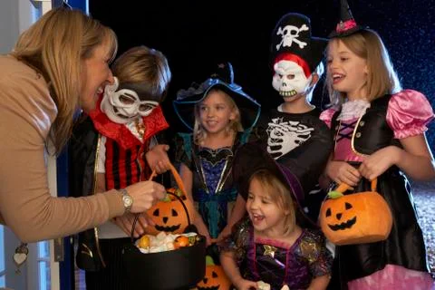 Happy Halloween party with children trick or treating Stock Photos