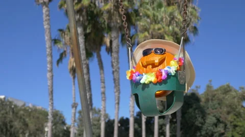 Happy Halloween pumpkin on the swing in 4K slow motion 60fps Stock Footage
