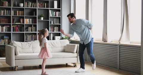 Happy handsome bearded dad dancing waltz with little daughter. Stock Footage 131278163