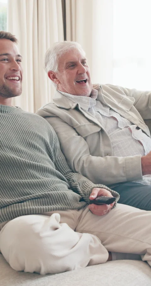 Happy, high five and senior man with son watching tv with remote control Stock Footage 341497373