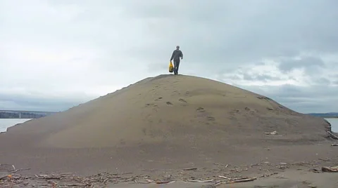 Happy Hiker Running Down Sandy Hill Video stock 2596609