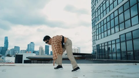 Happy hispanic dancer wears casual outfit break dancing at urban city. hiphop. Stock Footage 267169609