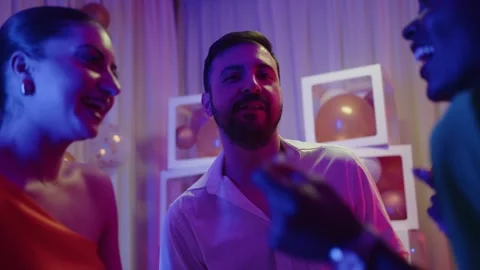 Happy Hispanic man at party dancing and enjoying fancy event Stock Footage 294564688