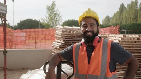 Happy Hispanic Manual Worker Smiling At Camera In Construction Site Stock Footage