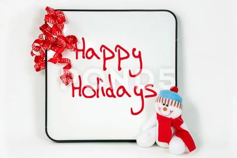 Happy holidays message on white board Stock Photos