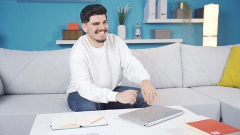 Happy home office worker looking at laptop and smiling. Stock-Footage 236207809