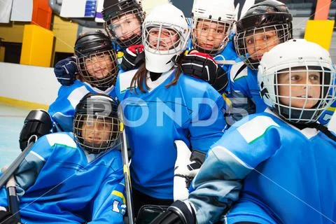 Happy ice hockey team with goaltender after game Stock Photos
