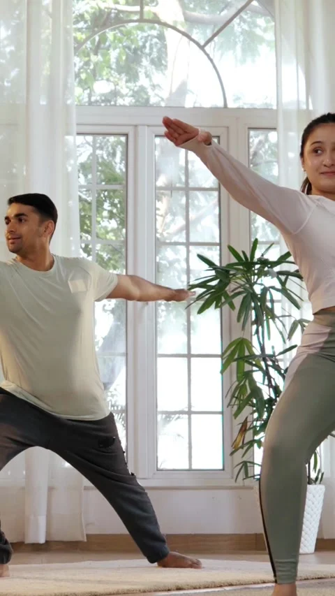 Happy Indian couple practicing yoga ina beautiful home Stock-Footage 343405529