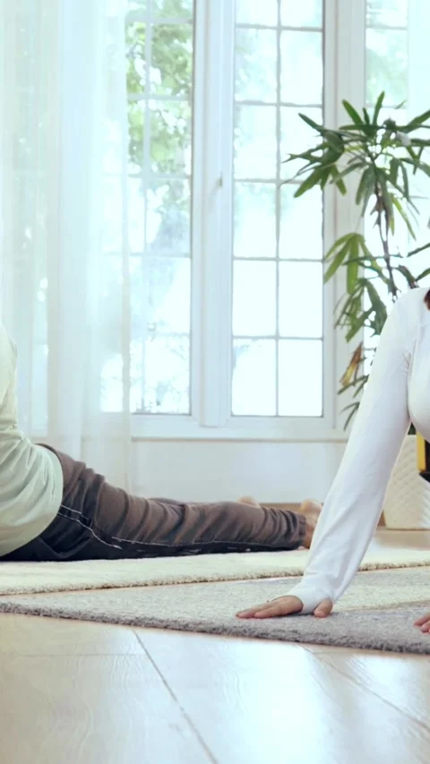 Happy Indian couple practicing yoga ina beautiful home Stock-Footage 343405733