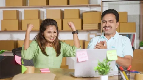 Happy Indian couples or small business owners celebrating success after getting Stock Footage 260470827