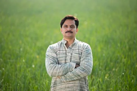 Happy Indian farmer in agricultural field outdoor Stock Photos