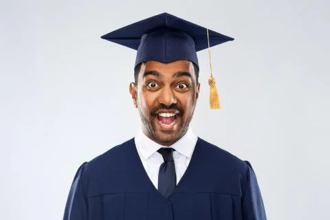 Happy indian graduate student in mortar board Stock Photos