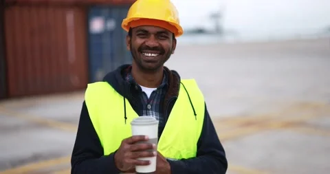 Happy Indian man looking on camera working at industrial port Stock-Footage 179971255
