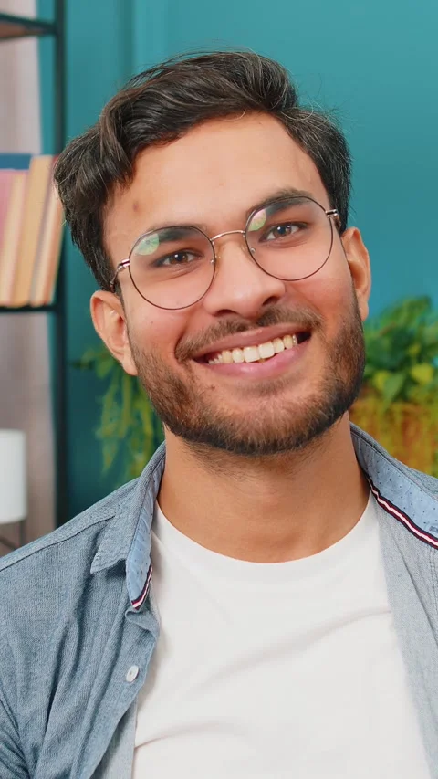 Happy Indian man smiling friendly, glad expression, feel satisfied concept good Stock Footage 320788608