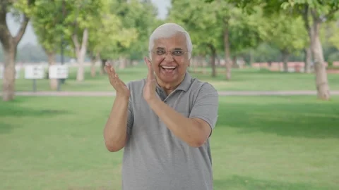 Happy Indian old man clapping and appreciating in park Video stock 280174191