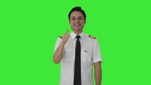 Happy Indian pilot doing Thumbs up Green screen Stock Footage 253160845