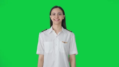 Happy Indian pilot smiling to the camera Green screen Stock Footage 250248005