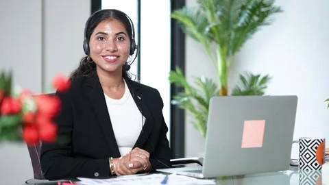 Happy indian service support operator or agent woman wearing headset lookin.. Stock Footage 295014284