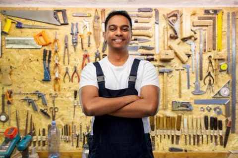 Happy indian worker or builder with crossed arms Stock Photos