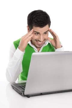 Happy isolated man with computer looking amused or amazed at the screen. Stock Photos